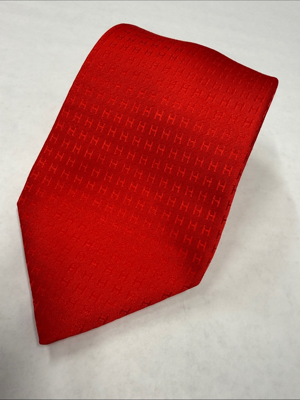 HERMÈS Bright Red Silk Faconnee "H" Pattern Tie